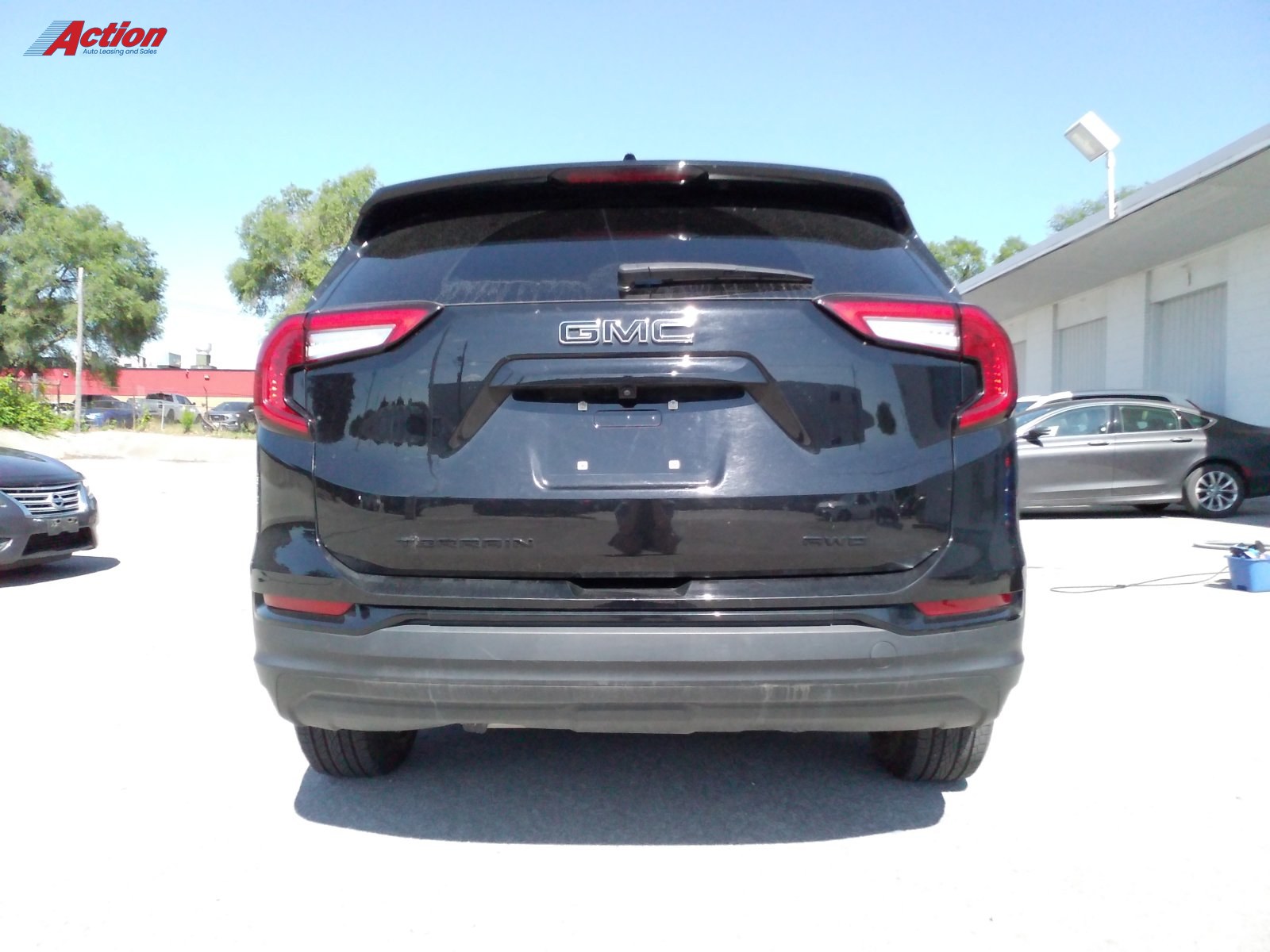 Black GMC Terrain rear view showcasing the vehicle's design and features.