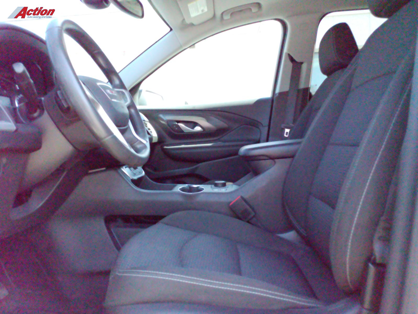 Interior view showcasing the front seats and dashboard of a vehicle.