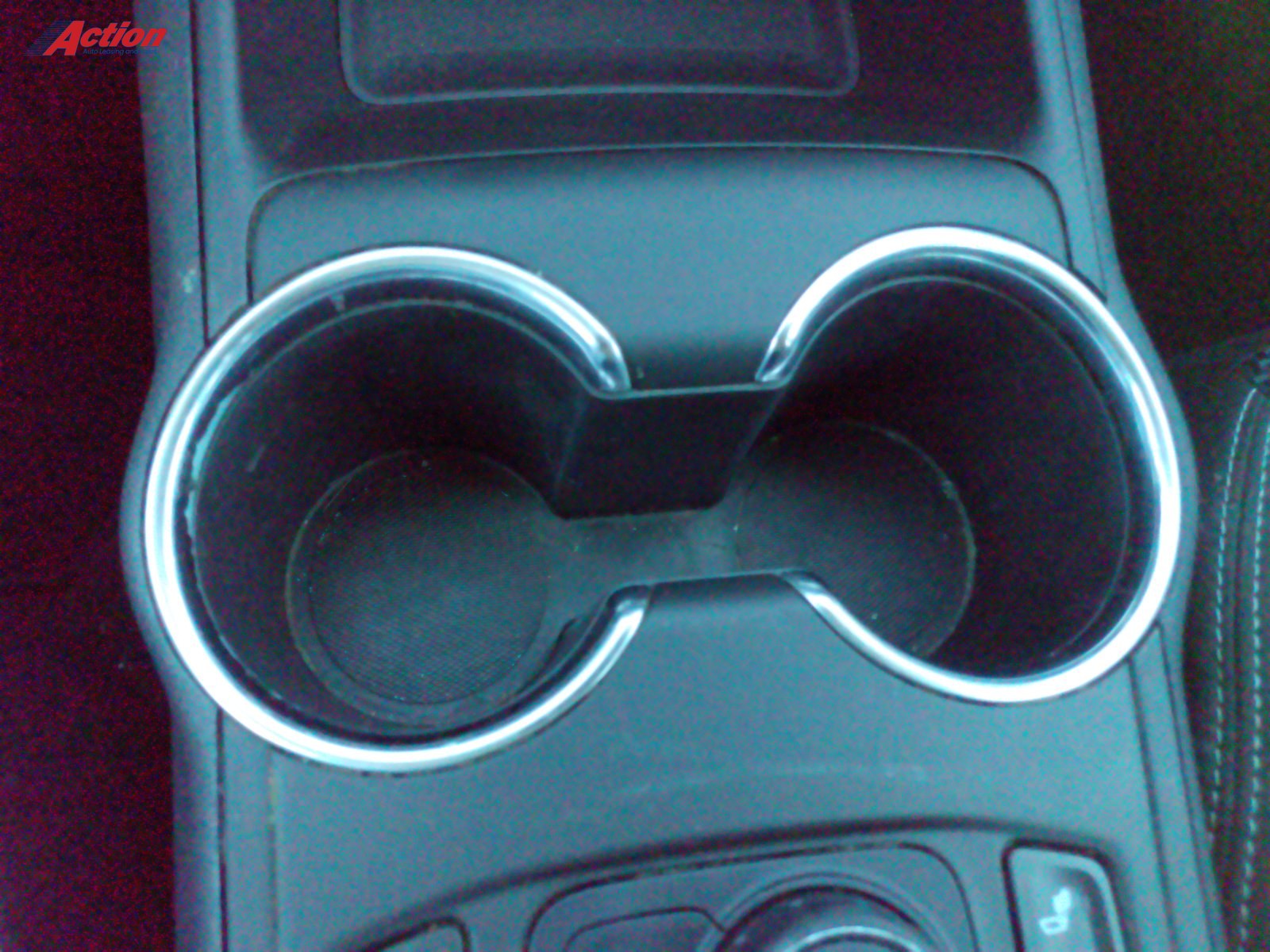 Cup holders in a vehicle's center console showcasing a sleek design.